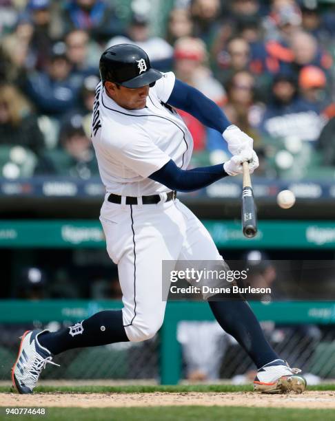 Mikie Mahtook of the Detroit Tigers hits a fly ball for an out against the Pittsburgh Pirates during the fifth inning of game one of a double-header...