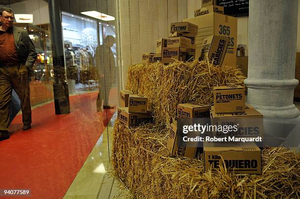 Christmas shoppers look at boxes offered for sale at the Cuidam charity drive December 6, 2009 in Barcelona, Spain. The volunteer program is selling...
