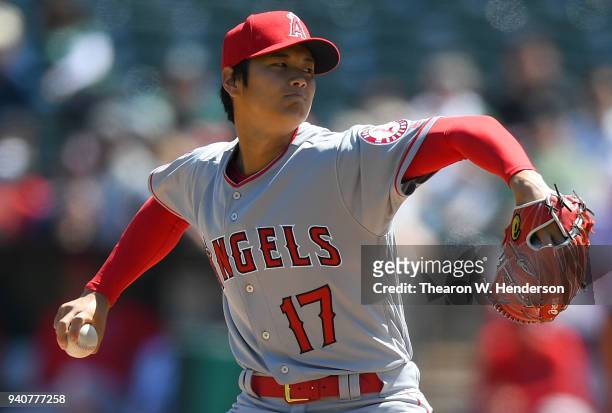 Shohei Ohtani of the Los Angeles Angels of Anaheim pitches in the bottom of the first inning of his Major League pitching debut against the Oakland...