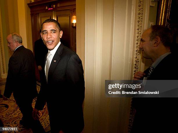 President Barack Obama leaves after a Democratic Caucus meeting on Capitol Hill December 6, 2009 in Washington, DC. President Barack Obama traveled...