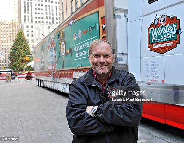 Dan Craig, the Facilities Operations Manager for the National Hockey League poses outside the Winter Classic truck that contains the ice-making...