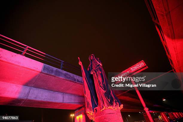 The sculpture 'The messenger' is illuminated with red light next to the Bella Center on December 6, 2009 in Copenhagen, Denmark. The art work is part...