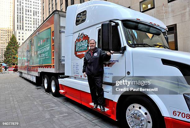 Dan Craig, the Facilities Operations Manager for the National Hockey League, poses outside the Winter Classic truck that contains the ice-making...