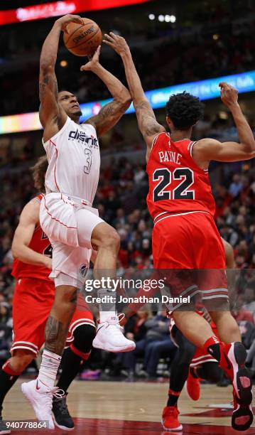 Bradley Beal of the Washington Wizards puts up a shot against Cameron Payne of the Chicago Bulls at the United Center on April 1, 2018 in Chicago,...