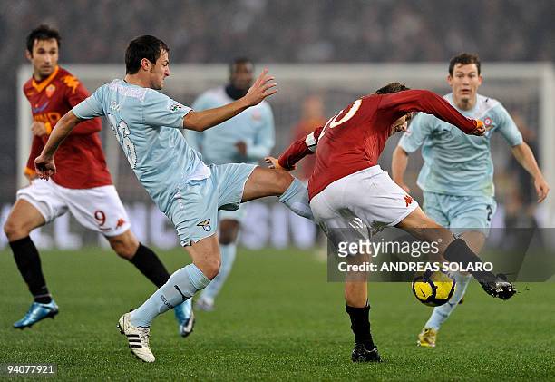 Roma's forward Francesco Totti fights for the ball against Lazio's defender Guglielmo Stendardo during their Italian Serie A football match on...
