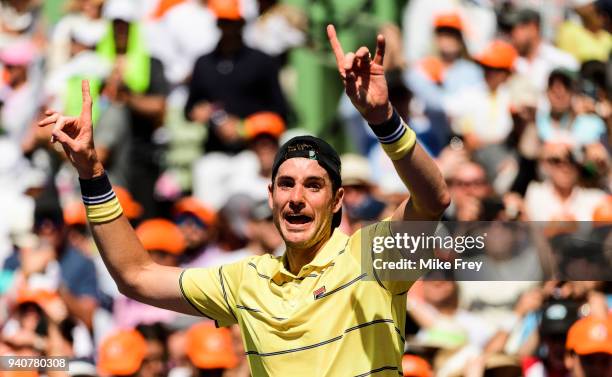 April 01: John Isner of the USA celebrates beating Alexander Zverev of Germany 6-7 6-4 6-4 in the men's final on Day 14 of the Miami Open Presented...