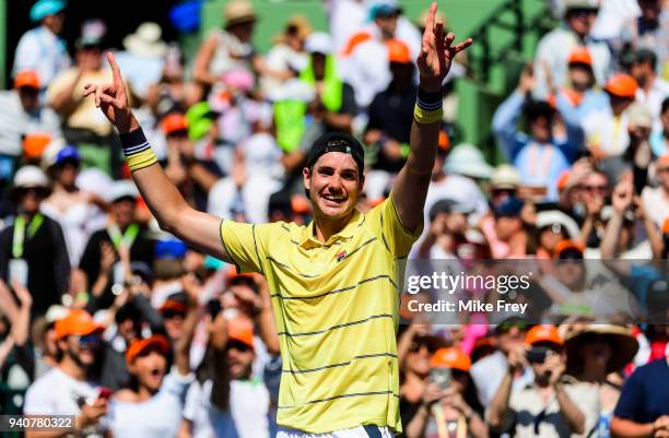 April 01: John Isner of the USA celebrates beating Alexander Zverev of Germany 6-7 6-4 6-4 in the men's final on Day 14 of the Miami Open Presented...