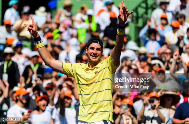 April 01: John Isner of the USA celebrates beating Alexander Zverev of Germany 6-7 6-4 6-4 in the men's final on Day 14 of the Miami Open Presented...