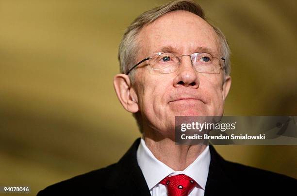 Senate Majority Leader Harry Reid pauses while speaking after a meeting with President Barack Obama and other Senate Democrats on Capitol Hill...