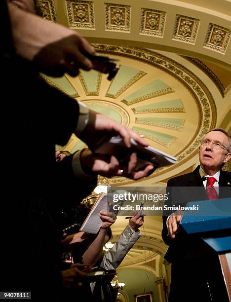 Senate Majority Leader Harry Reid speaks to reporters after a meeting with President Barack Obama and other Senate Democrats on Capitol Hill December...