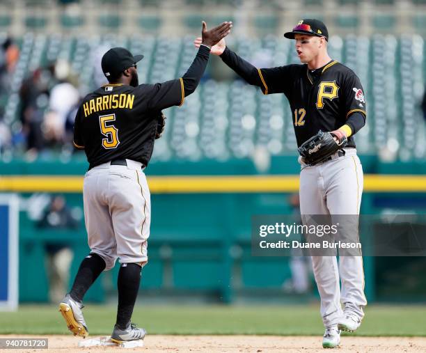 Josh Harrison and Corey Dickerson of the Pittsburgh Pirates celebrate after a 1-0 win over the Detroit Tigers in game one of a double-header at...