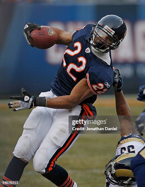 Matt Forte of the Chicago Bears is brought down by an illegal "horse-coillar" tackle by Paris Lenon of the St. Louis Rams at Soldier Field on...