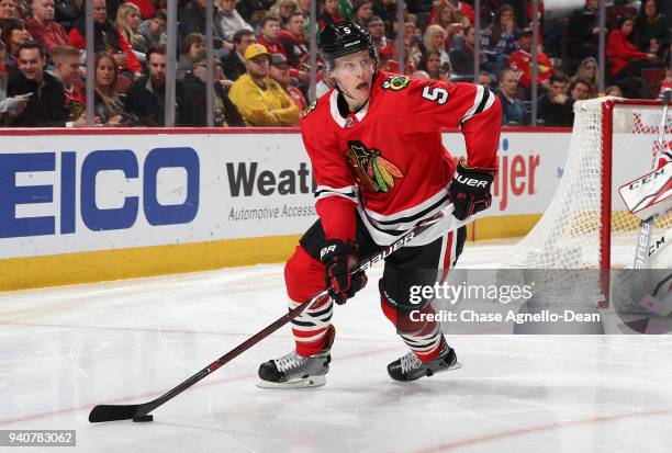 Connor Murphy of the Chicago Blackhawks grabs the puck in the third period against the Colorado Avalanche at the United Center on March 20, 2018 in...