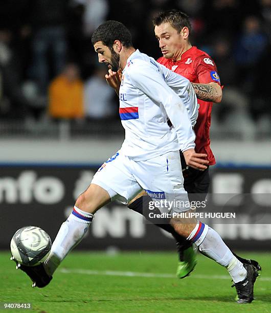 Lille's french midfielder Mathieu Debuchy vies with Lyon's forward Lisandro Lopez during their French L1 football match Lille vs Lyon, on December 6...