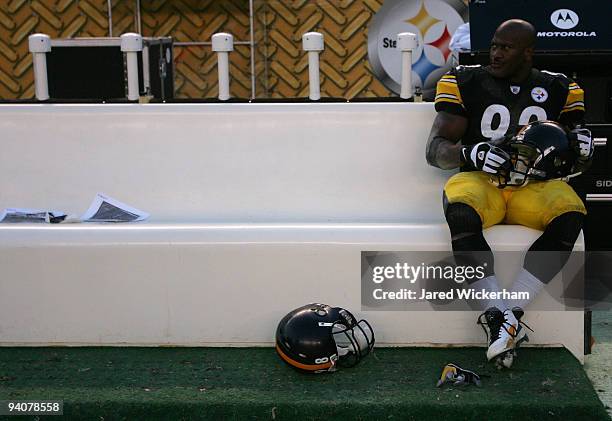 James Harrison of the Pittsburgh Steelers sits on the bench following their loss to the Oakland Raiders on December 6, 2009 at Heinz Field in...