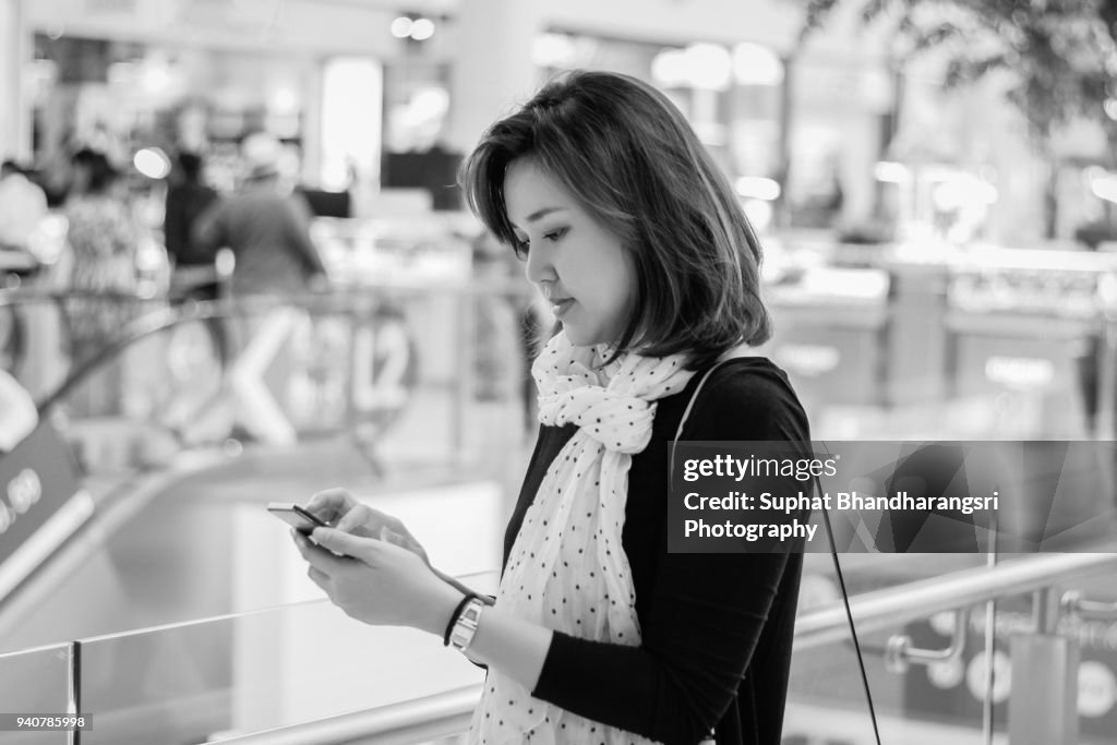 Woman texting someone on mobile phone