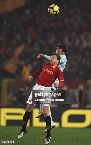Matteo Brighi of AS Roma and Stephan Radu of SS Lazio in action during the Serie A match between Roma and Lazio at Stadio Olimpico on December 6,...