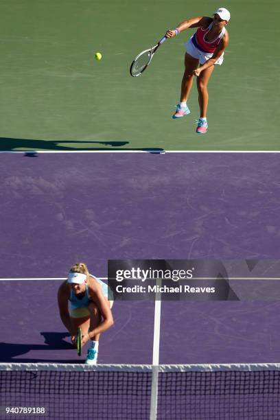 Ashleigh Barty of Australia serves to Barbora Krejcikova and Katerina Siniakova of the of the Czech Republic while playing with CoCo Vandeweghe of...