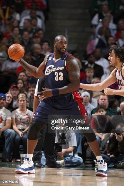 Shaquille O'Neal of the Cleveland Cavaliers posts up against Andrew Bogut of the Milwaukee Bucks on December 6, 2009 at the Bradley Center in...