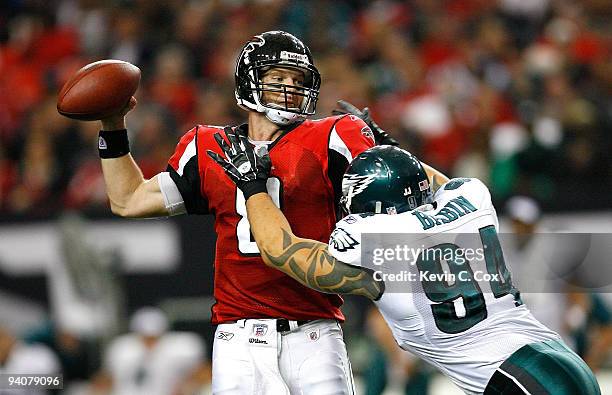 Jason Babin of the Philadelphia Eagles pressures quarterback Chris Redman of the Atlanta Falcons at Georgia Dome on December 6, 2009 in Atlanta,...