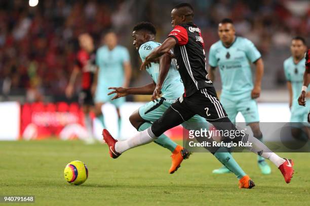 Jaine Barreiro of Atlas fights for the ball with Jorge Djaniny Tavares of Santos during the 13th round match between Atlas and Santos Laguna at...