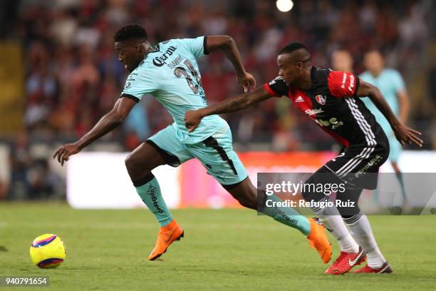 Jaine Barreiro of Atlas fights for the ball with Jorge Djaniny Tavares of Santos during the 13th round match between Atlas and Santos Laguna at...