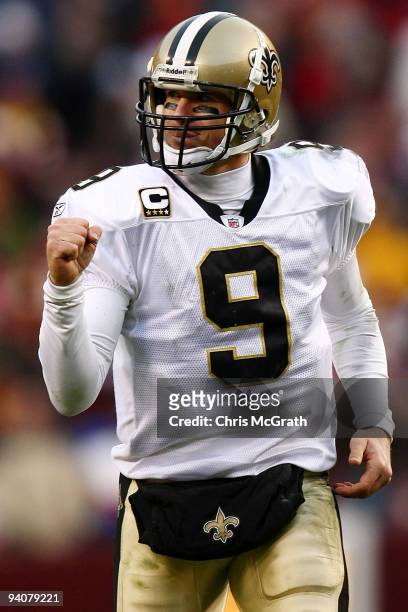 Drew Brees of the New Orleans Saints celebrates after team mate Robert Meachem scored a touchdown against the Washington Redskins on December 6, 2009...