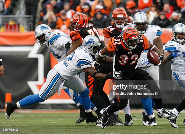 Cedric Benson of the Cincinnati Bengals breaks free from Anthony Henry of the Detroit Lions in their NFL game at Paul Brown Stadium December 6, 2009...