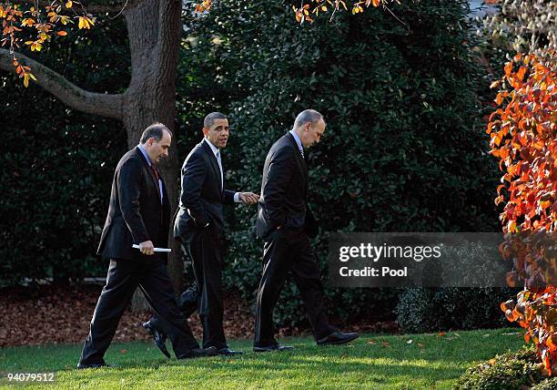 President Barack Obama returns to the Oval Office with Senior Advisor David Axelrod and Assistant to the President for Legislative Affairs Phil...