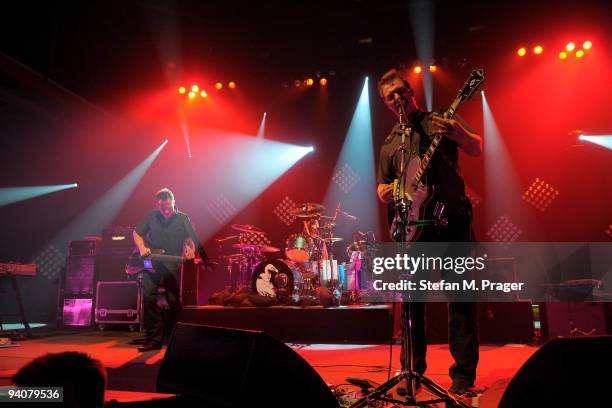John Paul Jones, Dave Grohl and Josh Homme perform on stage at Zenith on December 6, 2009 in Munich, Germany.