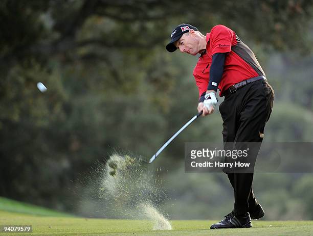 Jim Furyk hits a second shot on the 18th hole during the fourth round of the Chevron World Challenge at Sherwood Country Club on December 6, 2009 in...