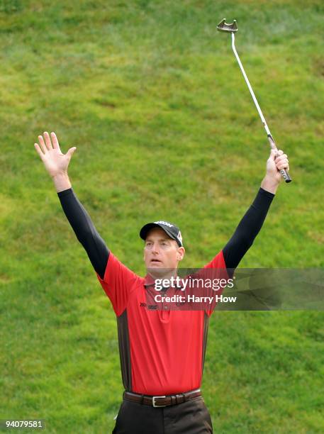 Jim Furyk celebrates a long putt to save par on the 17th hole during the fourth round of the Chevron World Challenge at Sherwood Country Club on...