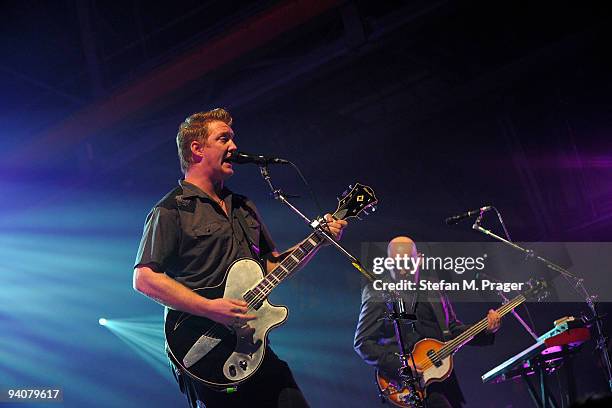 Josh Homme and Alain Johannes perform on stage at Zenith on December 6, 2009 in Munich, Germany.