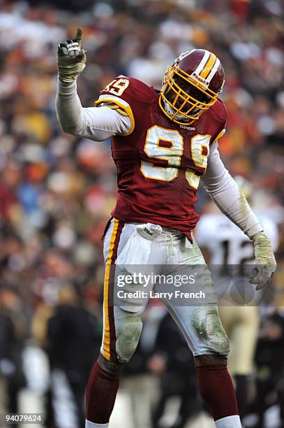 Andre Carter of the Washington Redskins celebrates a play during the game against the New Orleans Saints at FedExField on December 6, 2009 in...