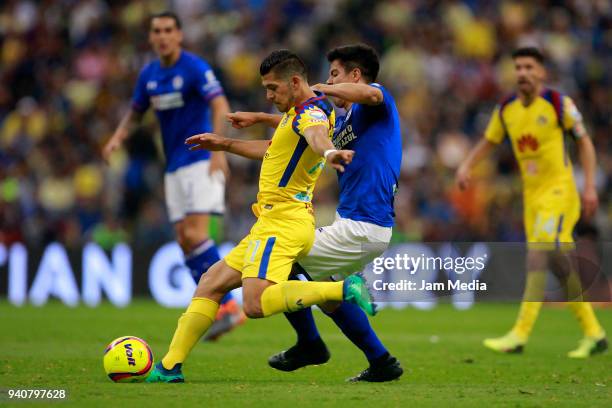 Henry Martin of America fights for the ball with Francisco Silva of Cruz Azul during the 13th round match between America and Cruz Azul as part of...