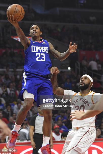 Lou Williams of the Los Angeles Clippers drives past Trevor Booker of the Indiana Pacers in the first half at Staples Center on April 1, 2018 in Los...