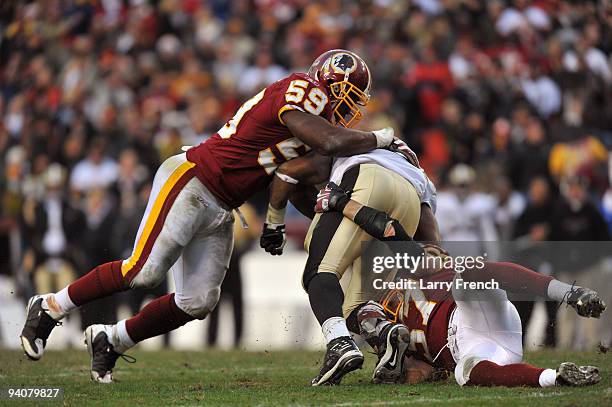 London Fletcher of the Washington Redskins makes a tackle during the game against the New Orleans Saints at FedExField on December 6, 2009 in...