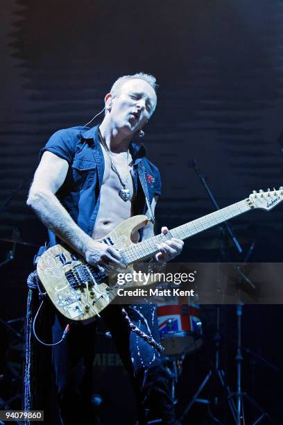 Phil Collen of Def Leppard performs with Man Raze, who supported Alice Cooper at Hammersmith Apollo on December 6, 2009 in London, England.