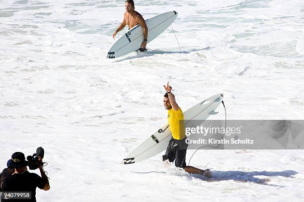 Joel Parkinson claims his victory as he exits the surf at the O'Neill World Cup of Surfing on December 6, 2009 in Sunset Beach, Hawaii.