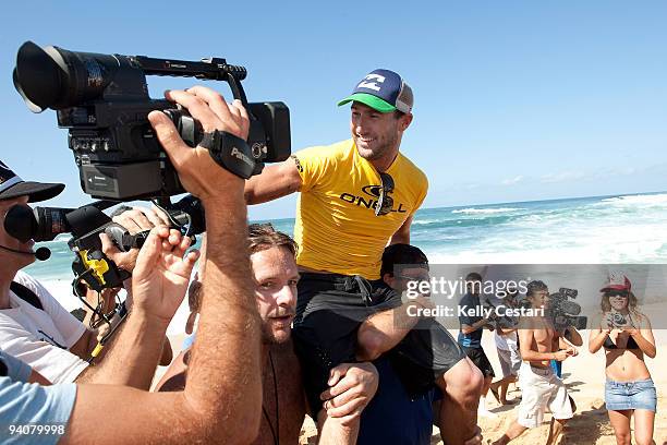 Joel Parkinson of Australia is chaired up the beach after winning his third O'Neill World Cup of Surfing on December 6, 2009 in Sunset Beach, Hawaii.