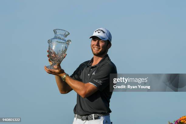 Sam Burns poses for photos with the trophy during the final round of the Web.com Tour's Savannah Golf Championship at the Landings Club Deer Creek...