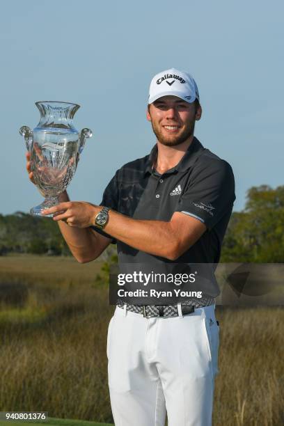 Sam Burns poses for photos with the trophy during the final round of the Web.com Tour's Savannah Golf Championship at the Landings Club Deer Creek...