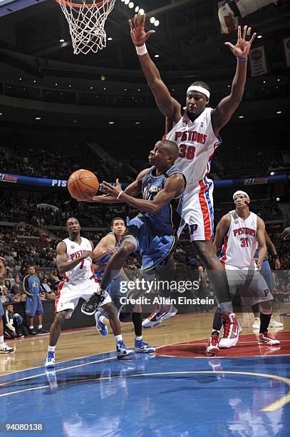 Earl Boykins of the Washington Wizards goes up for a shot attempt against Kwame Brown of the Detroit Pistons in a game at the Palace of Auburn Hills...