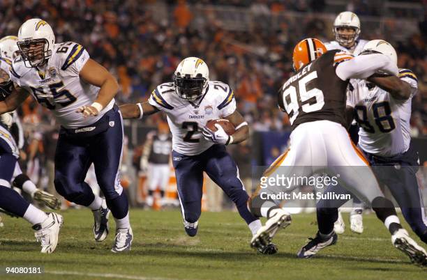 LaDainian Tomlinson of the San Diego Chargers follows blocker Louis Vasquez while scoring a touchdown against the Cleveland Browns at Cleveland...