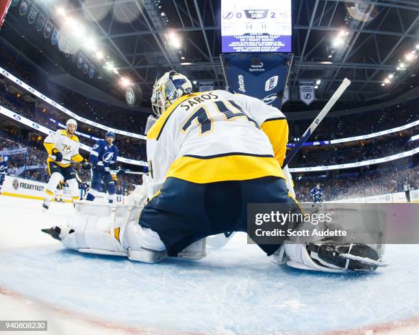 Goalie Juuse Saros of the Nashville Predators gives up a goal to Ondrej Palat of the Tampa Bay Lightning during the second period at Amalie Arena on...