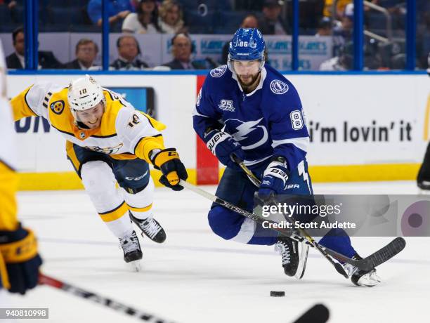 Nikita Kucherov of the Tampa Bay Lightning skates against Colton Sissons of the Nashville Predators during the third period at Amalie Arena on April...