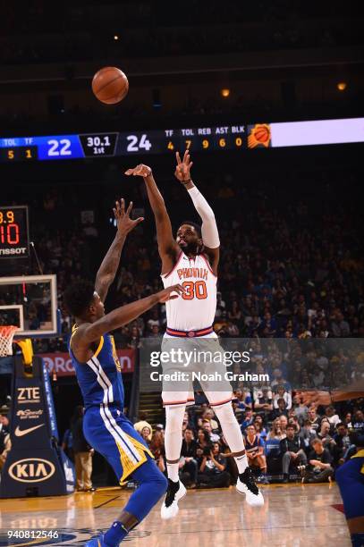 Troy Daniels of the Phoenix Suns shoots the ball against the Golden State Warriors on April 1, 2018 at ORACLE Arena in Oakland, California. NOTE TO...