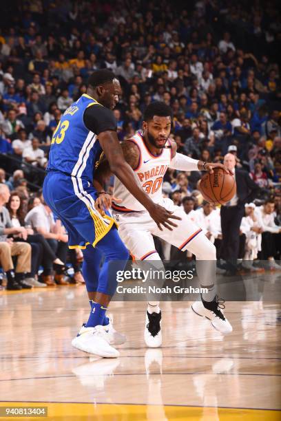 Troy Daniels of the Phoenix Suns handles the ball against the Golden State Warriors on April 1, 2018 at ORACLE Arena in Oakland, California. NOTE TO...