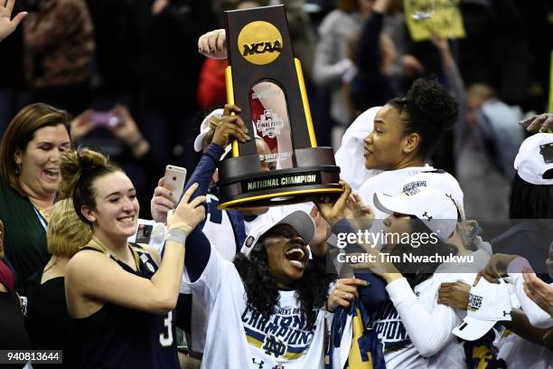 Notre Dame players celebrate winning the championship against Mississippi State during the championship game of the 2018 NCAA Photos via Getty Images...