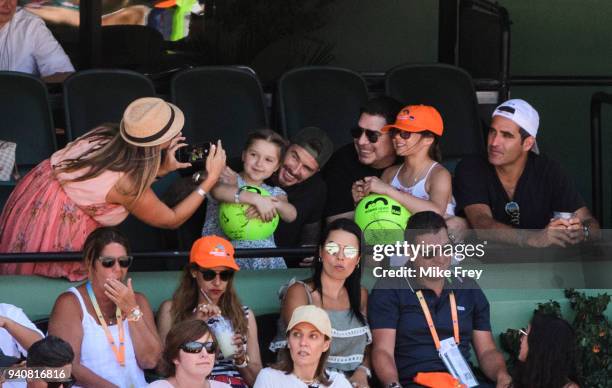 David Beckham and his daughter Harper watching John Isner of the USA against Zverev of Germany 6-7 6-4 6-4 in the men's final on Day 14 of the Miami...